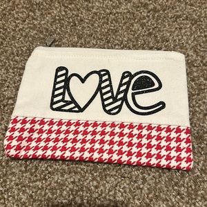 Brand new valentine zipper pouch! Perfect for storing small items.